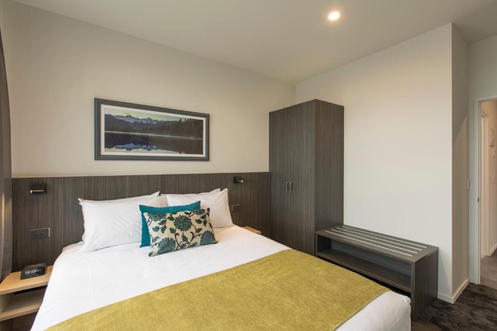 Postel nebo postele na pokoji v ubytování Quest on Manchester Serviced Apartments
