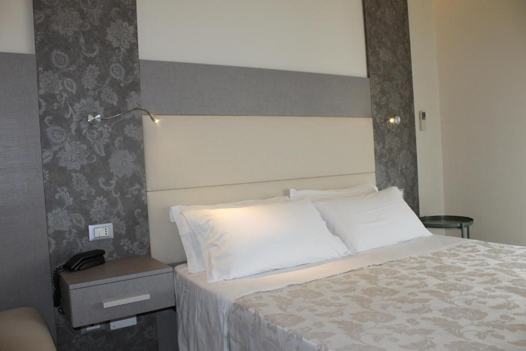 Postel nebo postele na pokoji v ubytování Hotel Astor B&B