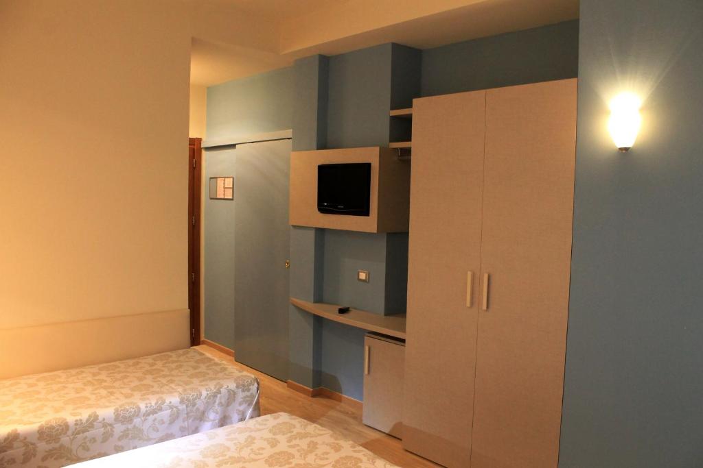 Postel nebo postele na pokoji v ubytování Hotel Astor B&B