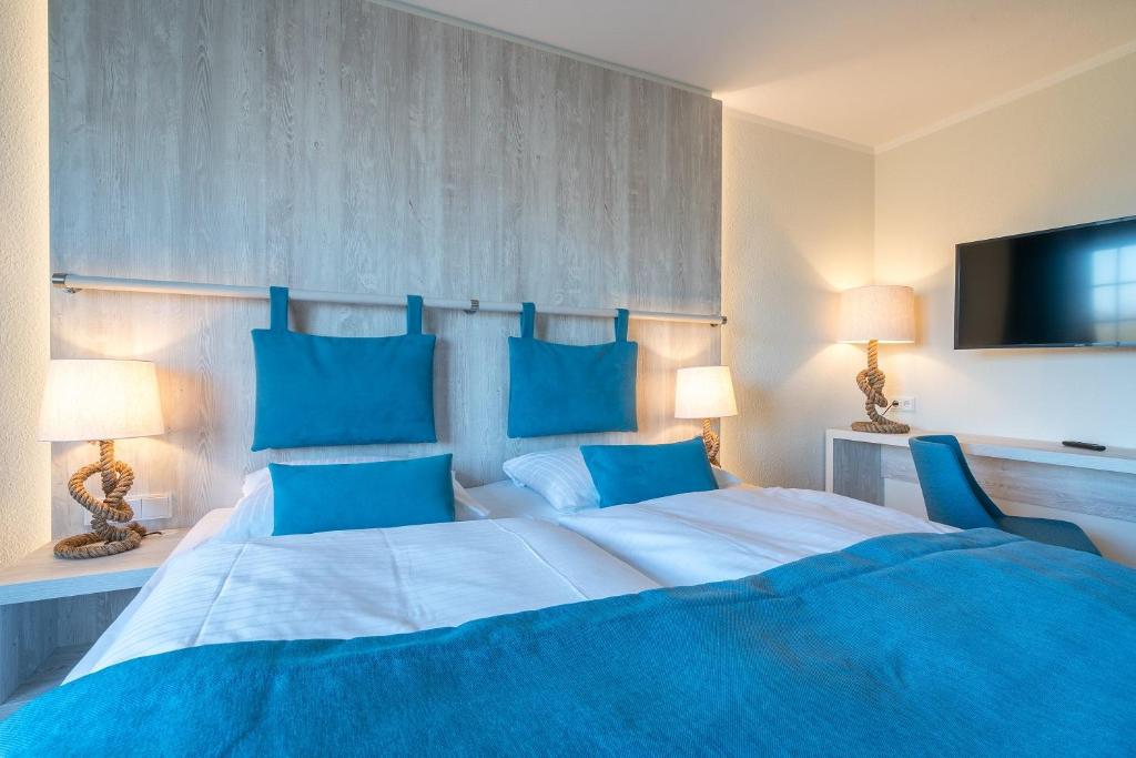 Postel nebo postele na pokoji v ubytování Hotel Garni Kölfhamm