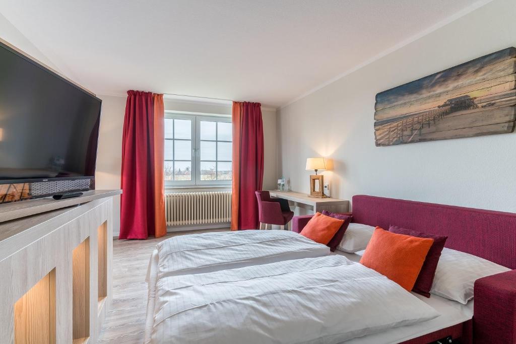 Postel nebo postele na pokoji v ubytování Hotel Garni Kölfhamm