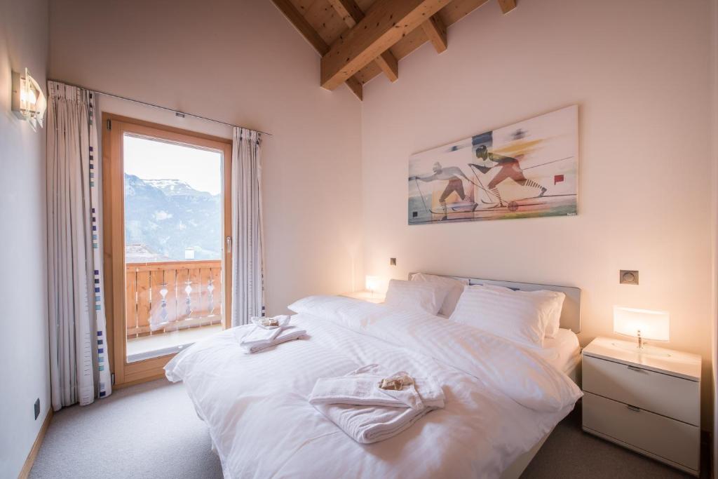 Voodi või voodid majutusasutuse Chalet Fortuna 4 Penthouse toas