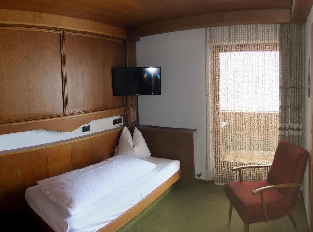 Posteľ alebo postele v izbe v ubytovaní Hotel Garni Obermair
