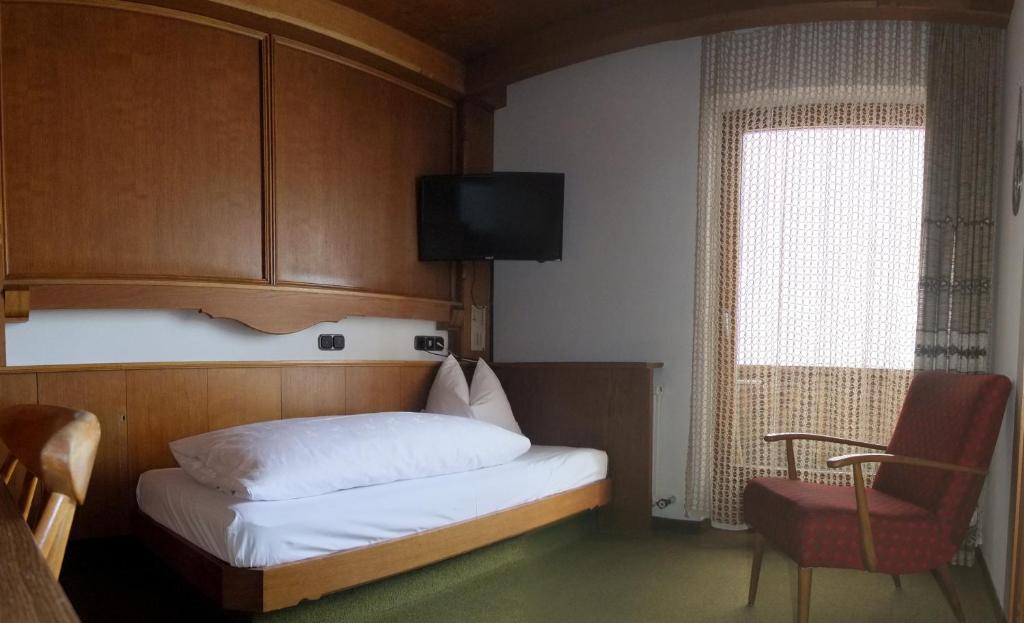 Posteľ alebo postele v izbe v ubytovaní Hotel Garni Obermair