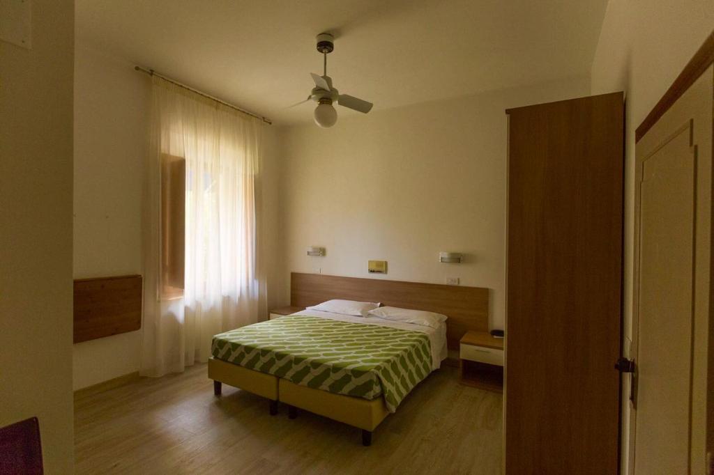 Postel nebo postele na pokoji v ubytování Albergo Le Sorgenti