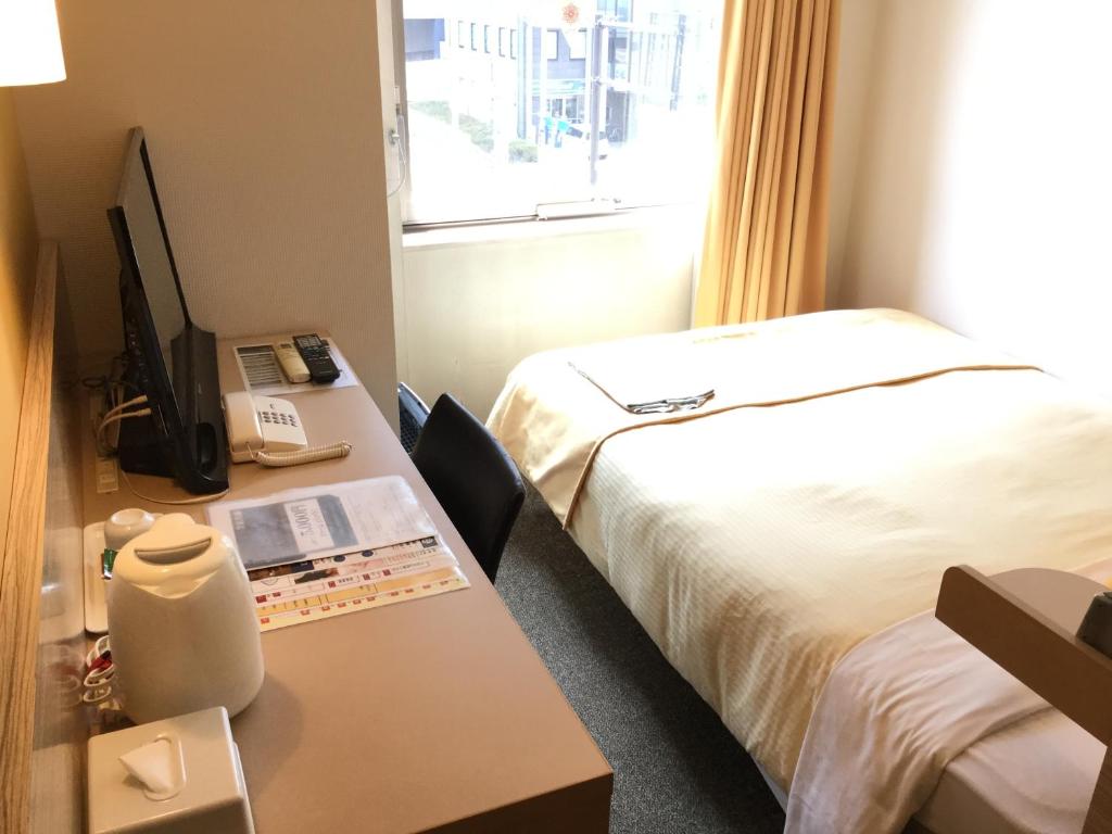 Postel nebo postele na pokoji v ubytování Hotel 1-2-3 Takasaki