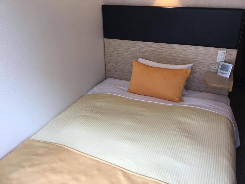 Postel nebo postele na pokoji v ubytování Hotel 1-2-3 Takasaki