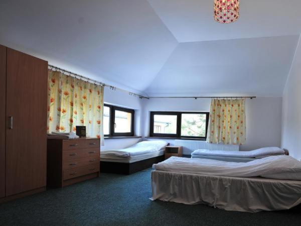 En eller flere senge i et værelse på Hotel Arkadia