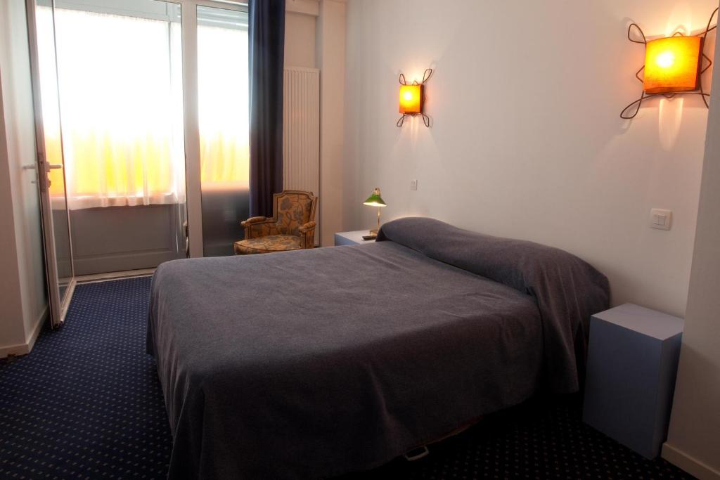 Rúm í herbergi á Hostel20 Toulouse Wilson