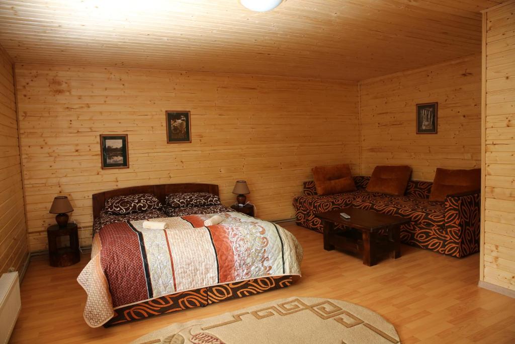 Postel nebo postele na pokoji v ubytování Zarinok