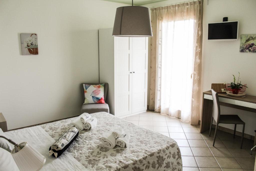 Posteľ alebo postele v izbe v ubytovaní B&B al Doremi