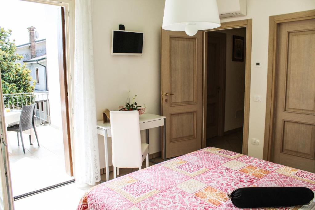 Posteľ alebo postele v izbe v ubytovaní B&B al Doremi