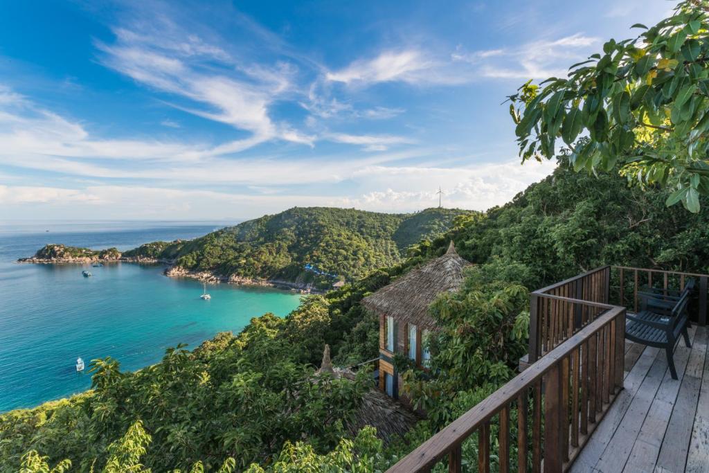 a balcony with a view of the ocean at Blue Heaven Resort Koh Tao in Koh Tao