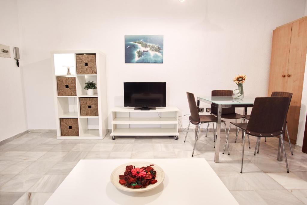 A television and/or entertainment centre at Pureza Oasis Suite