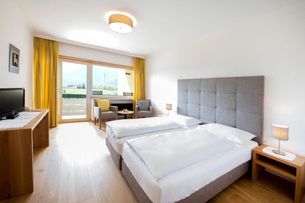 Postel nebo postele na pokoji v ubytování Hotel Greifenstein