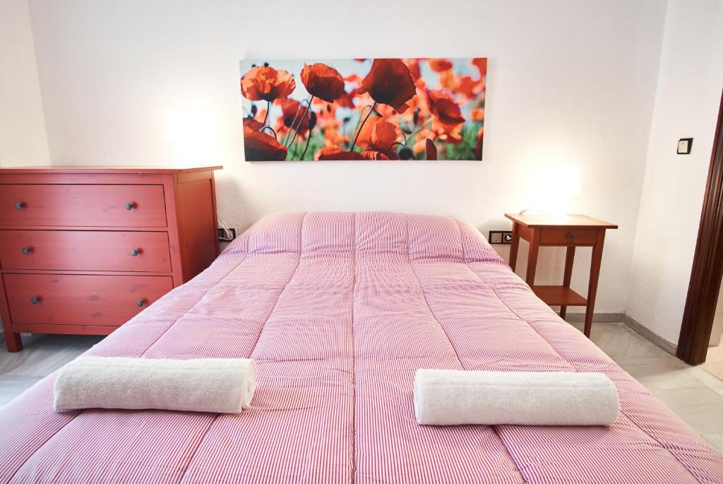 A bed or beds in a room at Pureza Oasis Suite