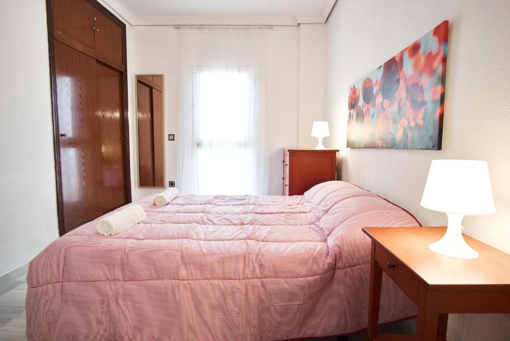 A bed or beds in a room at Pureza Oasis Suite