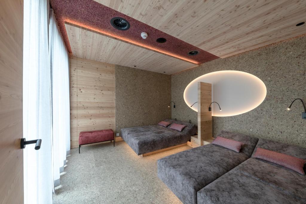 Postel nebo postele na pokoji v ubytování Holzleiten - Bio Wellness Hotel