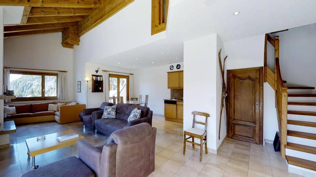 a living room with a couch and a table at Corvatsch 3/47 in Silvaplana