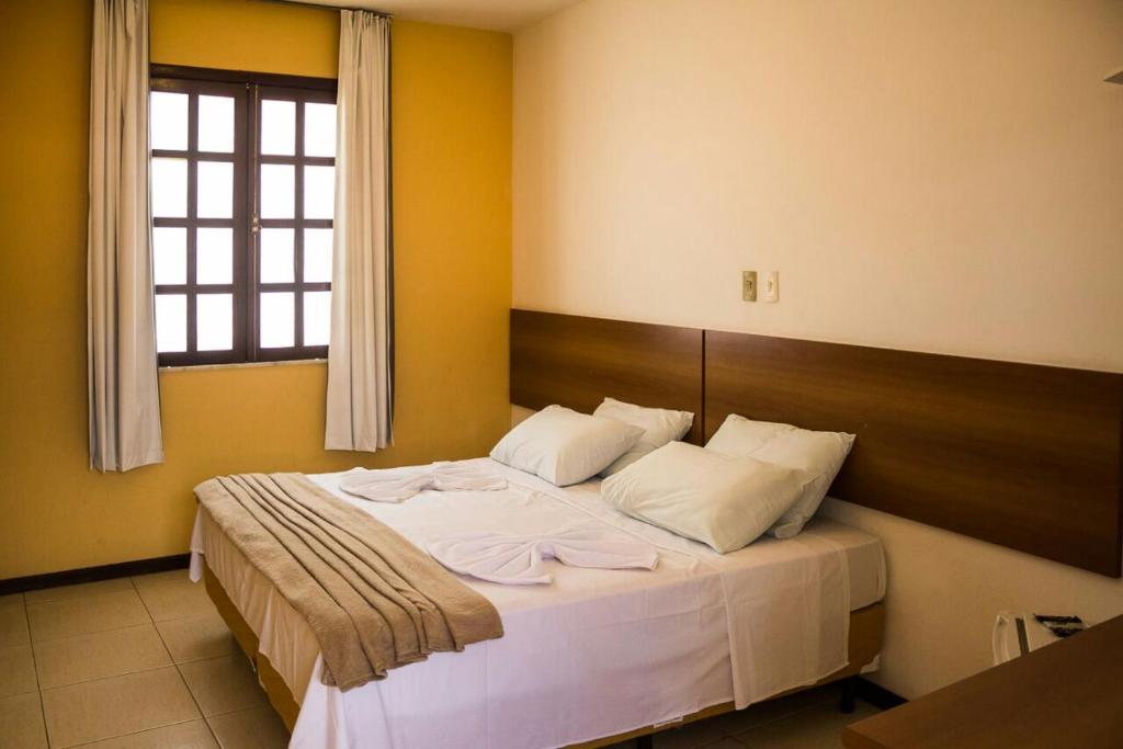 Postel nebo postele na pokoji v ubytování Hotel Pousada Trevo