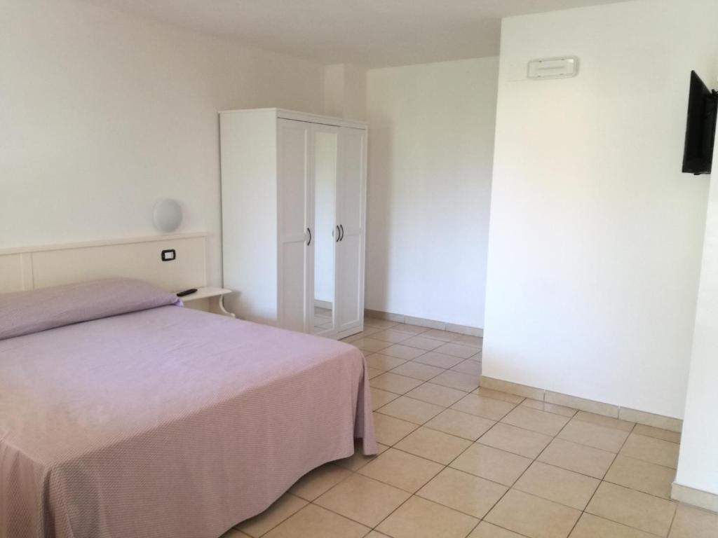 Postel nebo postele na pokoji v ubytování Hotel Residence Turium