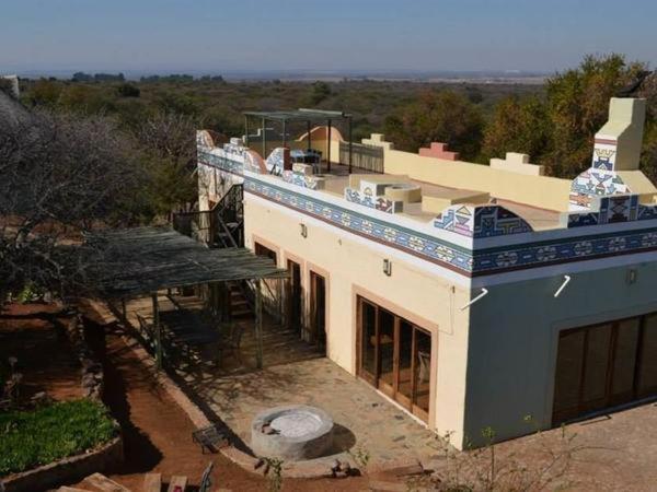 an overhead view of a house with a roof at KweKwe Private Game Lodge in Marble Hall