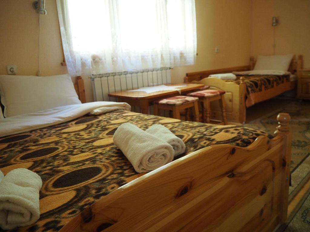 Postel nebo postele na pokoji v ubytování Орбелус