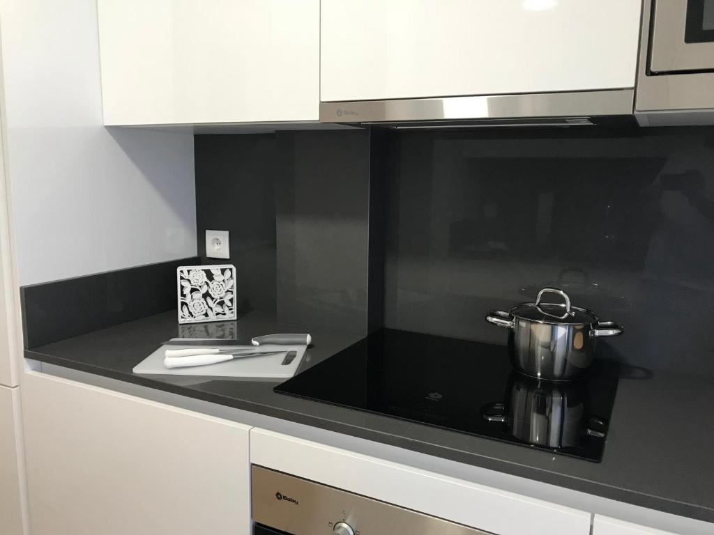 A kitchen or kitchenette at Apartamentos Areas