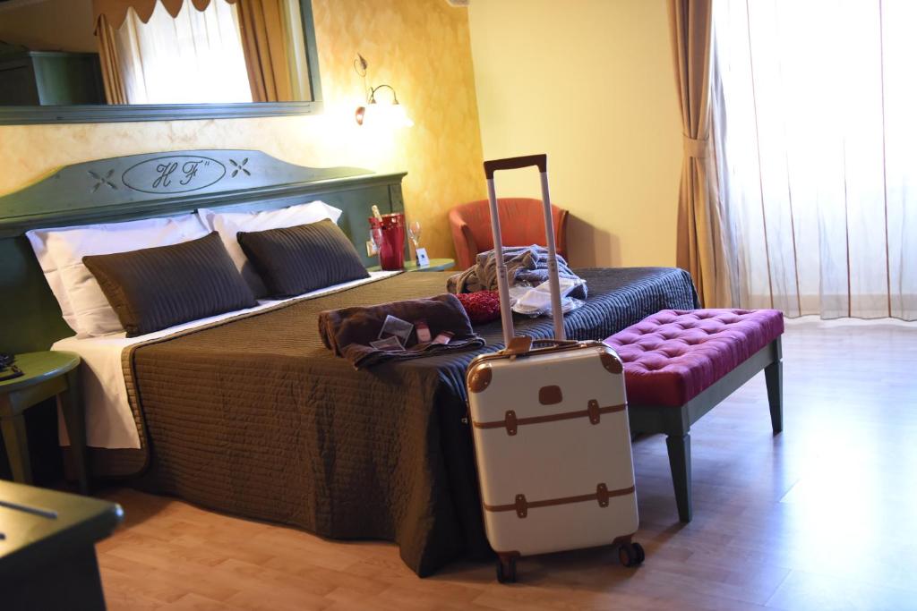 Postel nebo postele na pokoji v ubytování Hotel Federico II