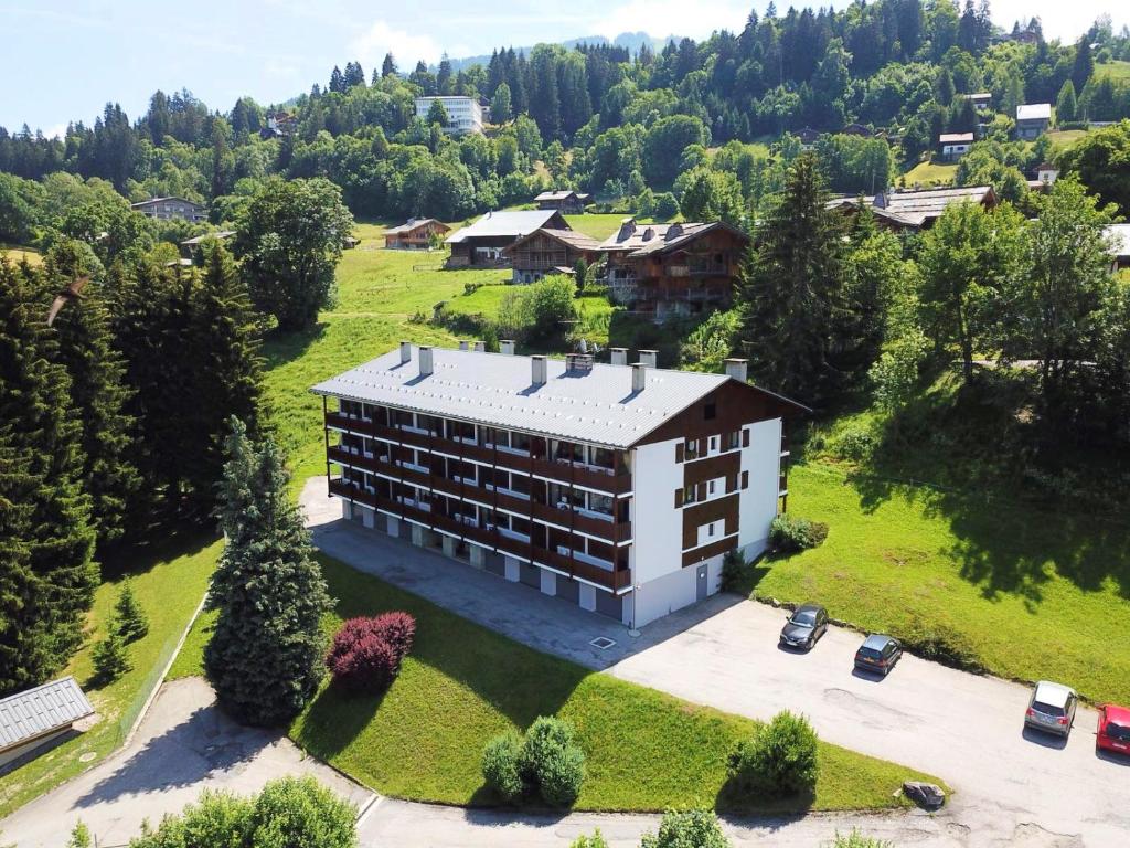 an aerial view of a building in a field at Résidence Le Relax - Megève Centre in Megève