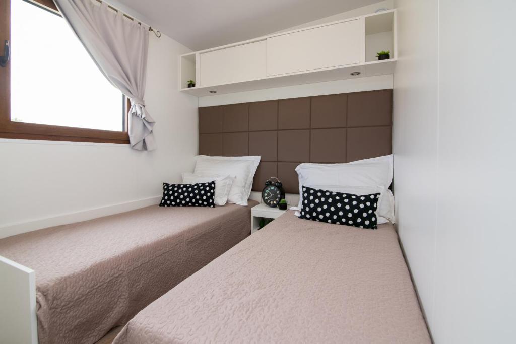 Postel nebo postele na pokoji v ubytování Estate Villa Duo