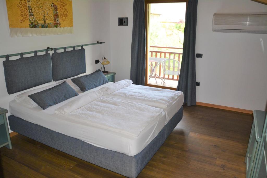 Posteľ alebo postele v izbe v ubytovaní Agritur La Cort