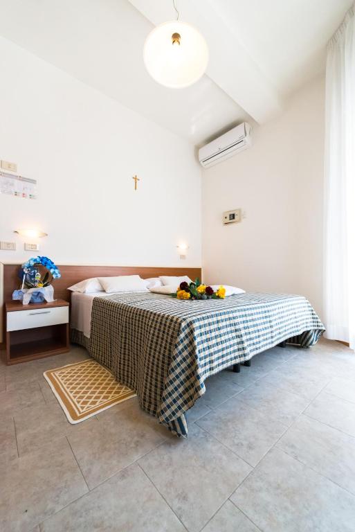 Postel nebo postele na pokoji v ubytování Hotel Lem-Casadei