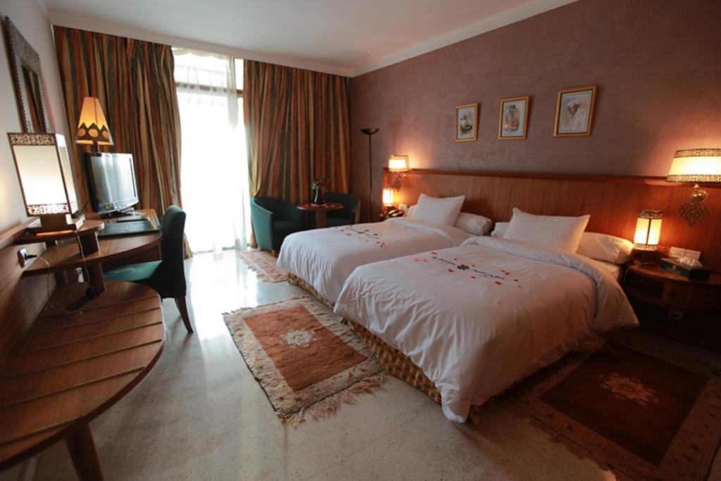 Postel nebo postele na pokoji v ubytování Hotel Transatlantique