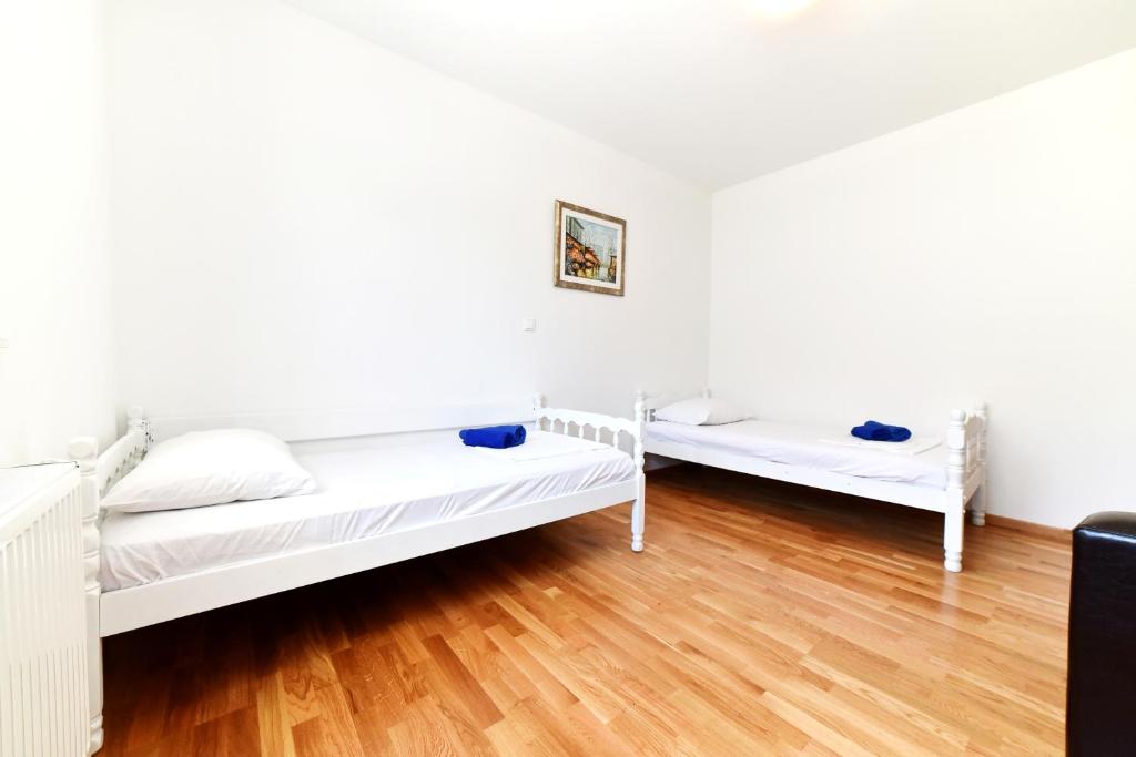 Postel nebo postele na pokoji v ubytování Apartman Hertz
