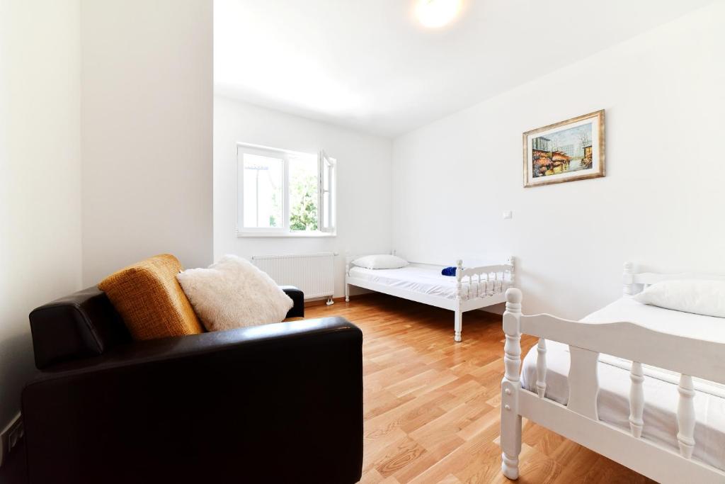 Postel nebo postele na pokoji v ubytování Apartman Hertz