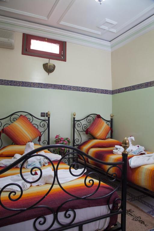 Postel nebo postele na pokoji v ubytování Riad Saad