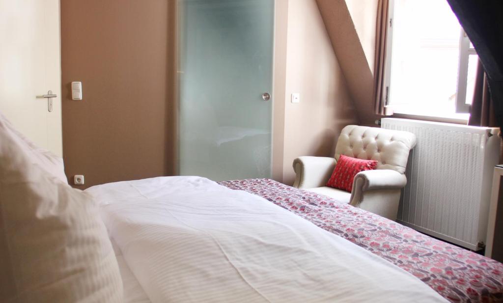 Postel nebo postele na pokoji v ubytování Hotel Schmuckkästchen