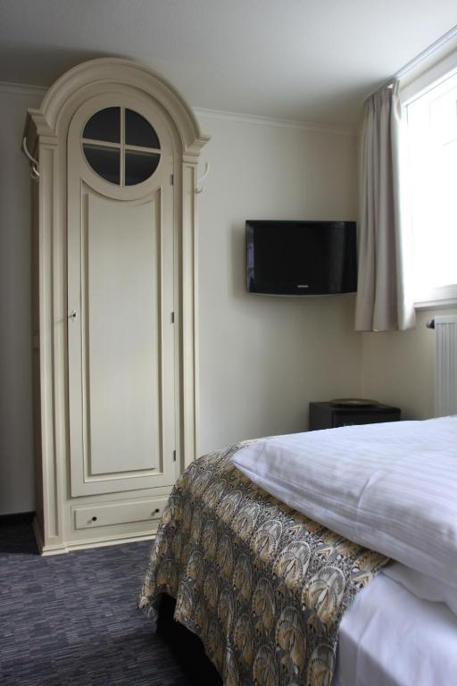 Postel nebo postele na pokoji v ubytování Hotel Schmuckkästchen