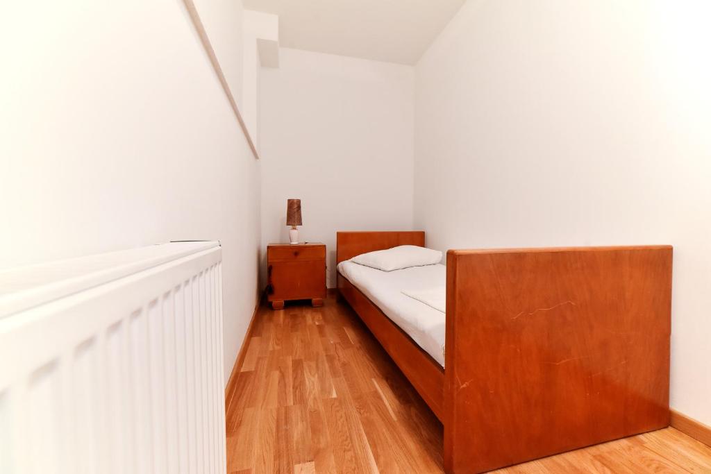 Postel nebo postele na pokoji v ubytování Apartman Hertz