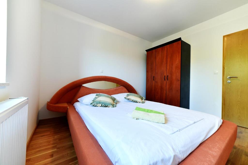 Postel nebo postele na pokoji v ubytování Apartman Hertz