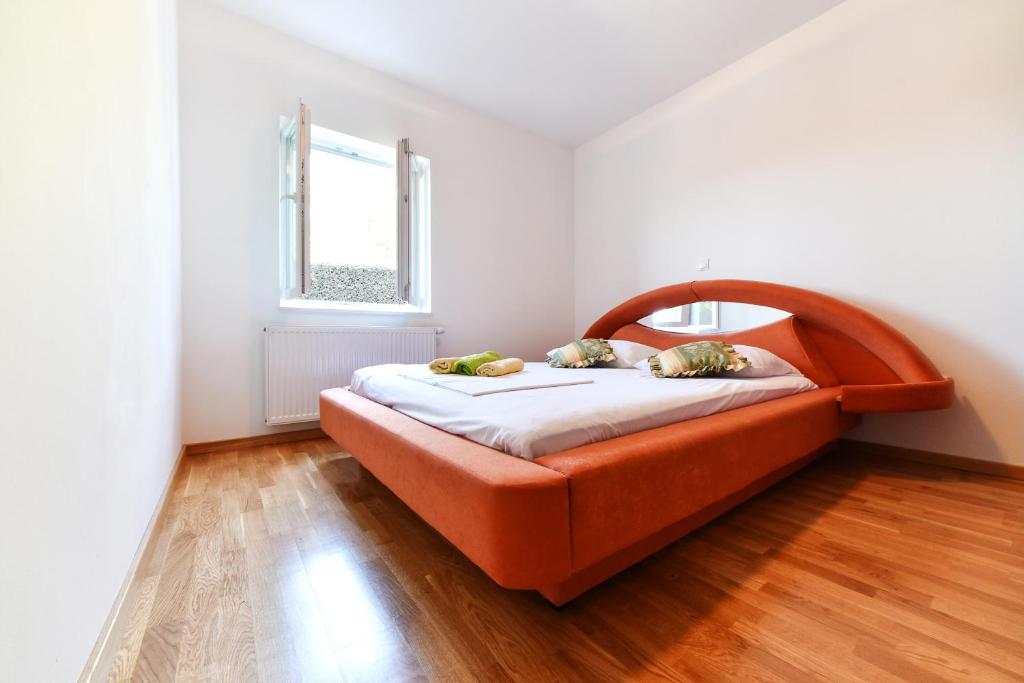 Postel nebo postele na pokoji v ubytování Apartman Hertz