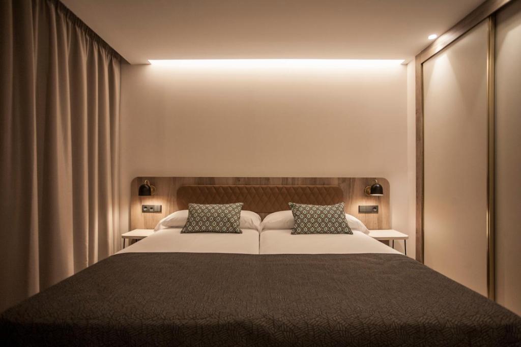 Łóżko lub łóżka w pokoju w obiekcie Hotel Presidente 4 sup