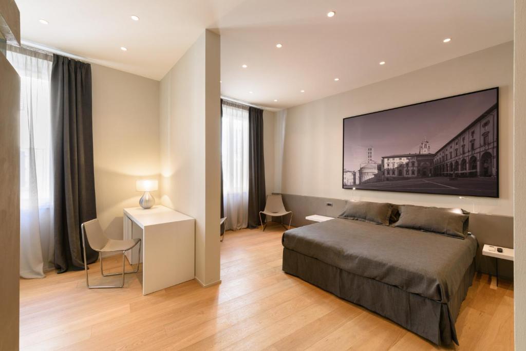 Palazzo Vasarri - Luxury design suitesにあるベッド
