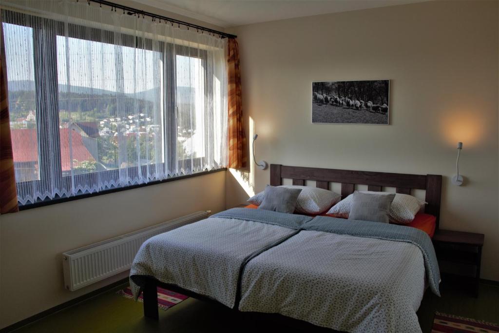 Postel nebo postele na pokoji v ubytování Apartmány Hutisko 769