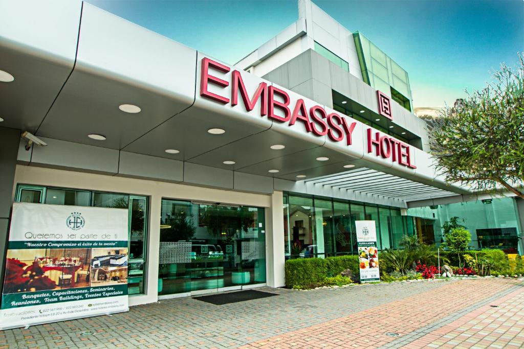 a grocery store with a sign on the front of it at Embassy Quito in Quito