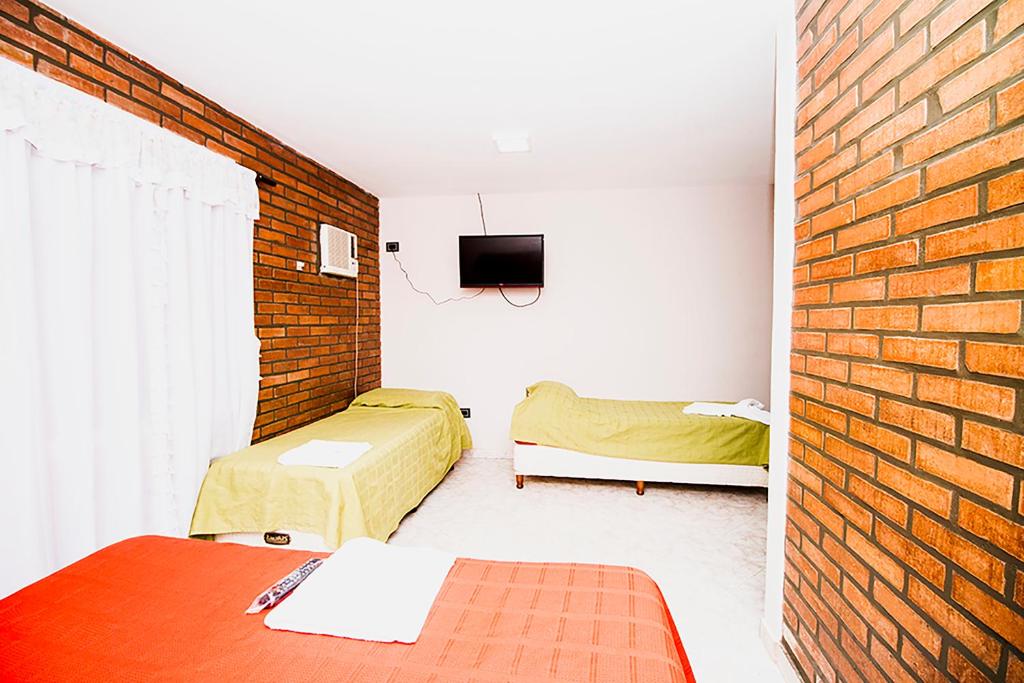 Postel nebo postele na pokoji v ubytování Posada Madre America