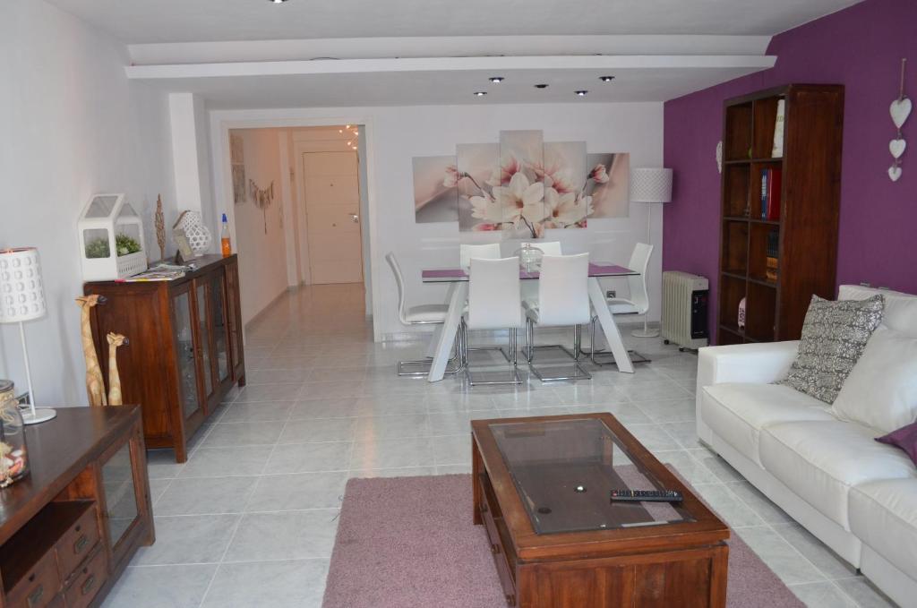 a living room with a couch and a table at Sweet Caroline Apartment in Valencia