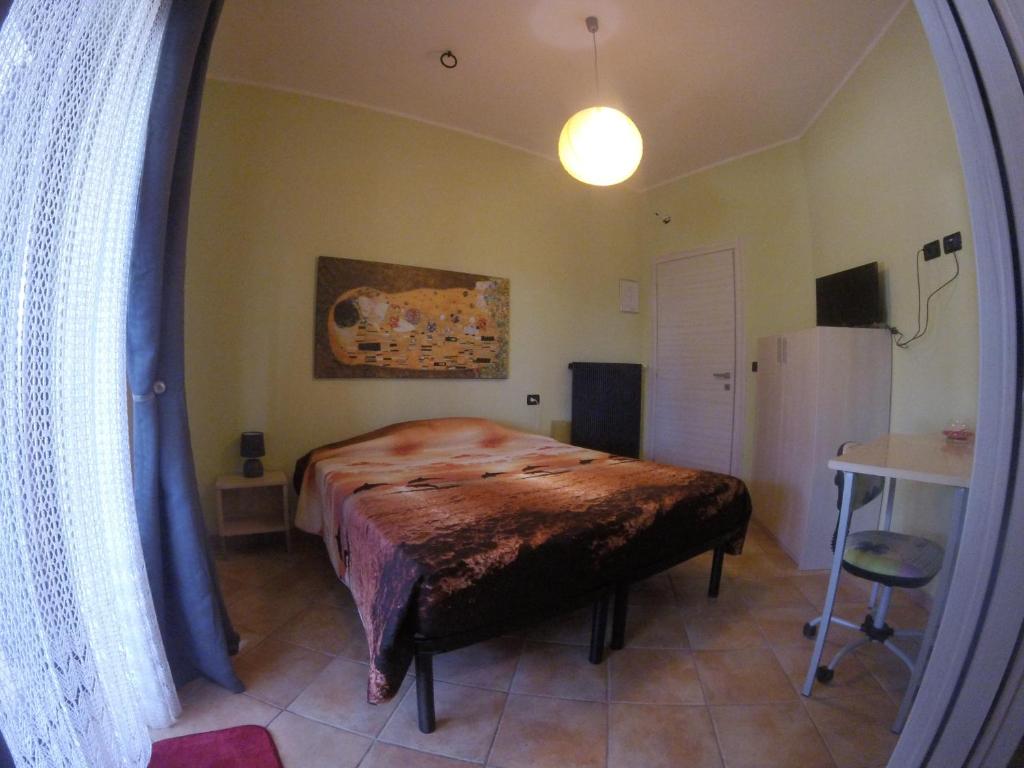 Postel nebo postele na pokoji v ubytování Il Roseto di Daniela