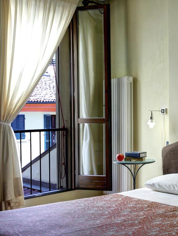 Postel nebo postele na pokoji v ubytování Hotel De Prati